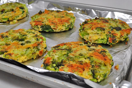 Half baked broccoli patties before flipping.